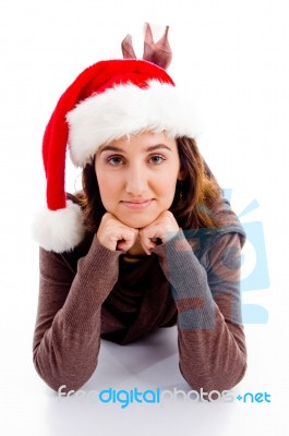 Lying Female Wearing Santa Hat Stock Photo