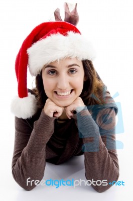 Lying Female Wearing Santa Hat Stock Photo