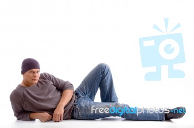 Lying Guy Wearing Woollen Cap Stock Photo