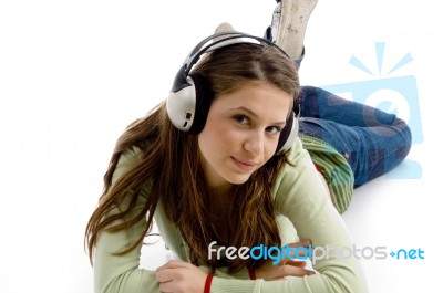 Lying Woman Enjoying Music Stock Photo