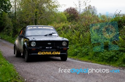 M. Conlon Driving Ford Escort Stock Photo