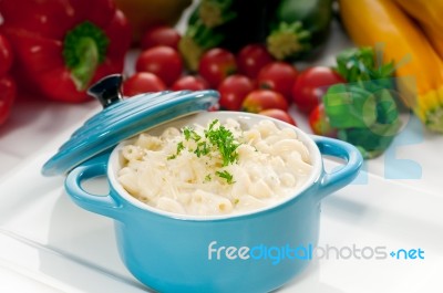 Mac And Cheese On A Blue Little Clay Pot Stock Photo