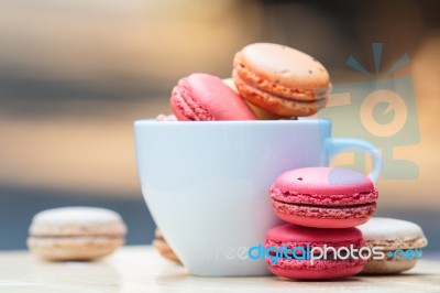 Macaron In Coffee Cup Stock Photo