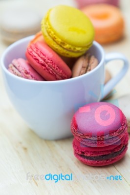 Macaron In Coffee Cup Stock Photo