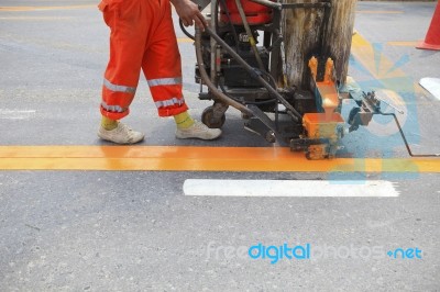 Machine And Worker At Road Construction Stock Photo