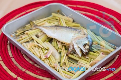 Mackerel Fish On A Grill With Lemongrass Stock Photo