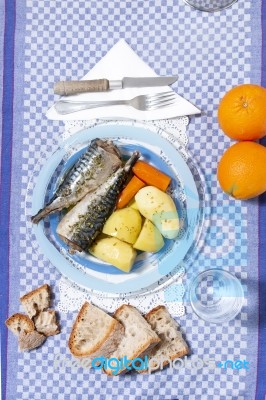 Mackerel Fish With Potato And Carrot Stock Photo