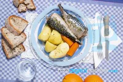 Mackerel Fish With Potato And Carrot Stock Photo