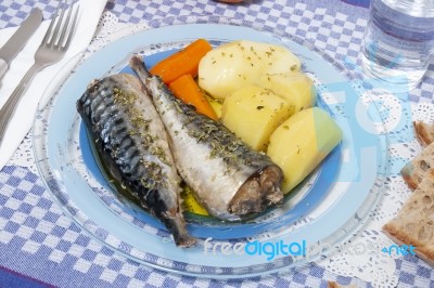 Mackerel Fish With Potato And Carrot Stock Photo