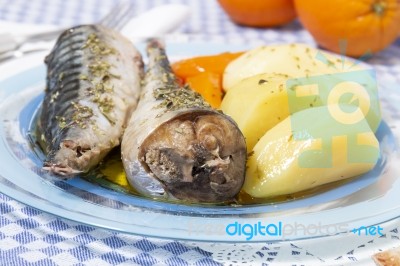 Mackerel Fish With Potato And Carrot Stock Photo