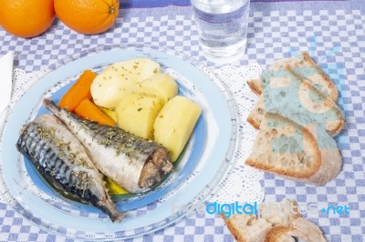 Mackerel Fish With Potato And Carrot Stock Photo