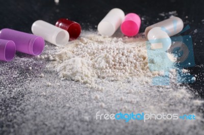 Macro Shot Of Powder By Open Pills Stock Photo