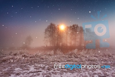 Magic Winter Christmas Night. Snowfall Scene On A River Stock Photo