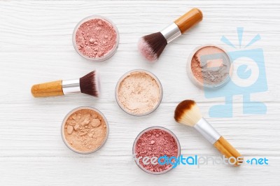 Makeup Powder With Brushes On Wood Background Stock Photo