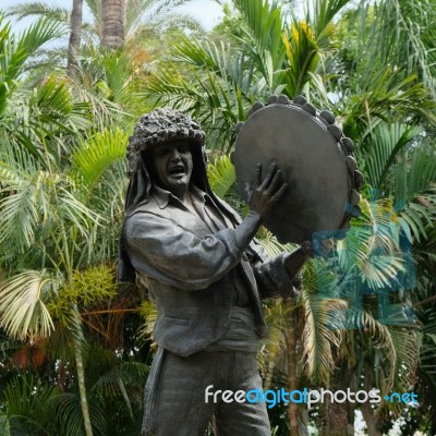 Malaga, Andalucia/spain - July 5 : Statue Of Man Holding A Tambo… Stock Photo