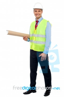 Male Architect Holding Blueprints Stock Photo