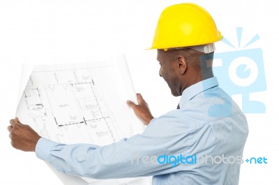 Male Architect Viewing Blue Print Stock Photo