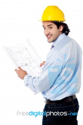 Male Architect With Construction Plan Stock Photo