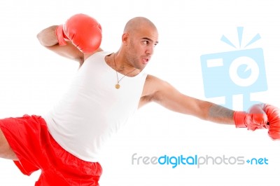 Male Boxer In Pose To Punch Hard Stock Photo