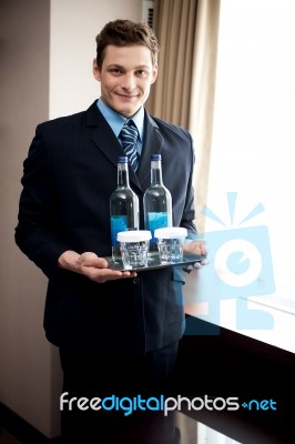 Male Butler Holding Beverages Stock Photo