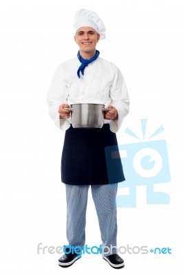 Male Chef Holding A Steel Saucepan Stock Photo