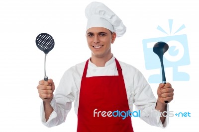 Male Chef Holding Kitchen Essentials Stock Photo