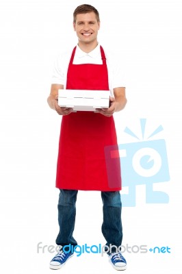 Male Chef Holding Pizza Box Stock Photo