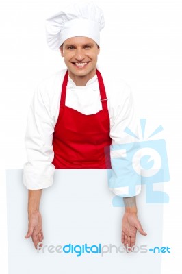 Male Chef Posing Behind Blank Board Stock Photo