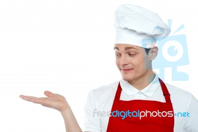 Male Chef Showing Open Palm Stock Photo