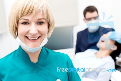 Male Dentist Doing Teeth Checkup Behind Stock Photo