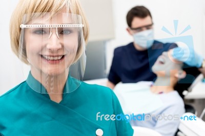 Male Dentist With Patient, In Clinic Stock Photo