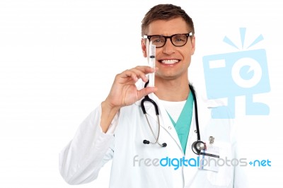 Male Doctor Holding injection Stock Photo