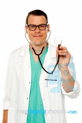 Male Doctor Showing Stethoscope Stock Photo