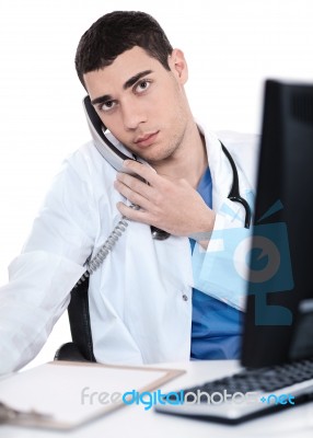 Male Doctor Speaking Over Telephone Stock Photo