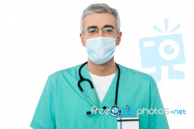 Male Doctor With Face Mask Stock Photo