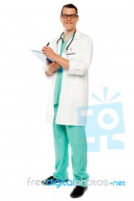 Male Doctor Writing Prescription Stock Photo