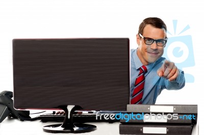 Male Executive In Glasses Pointing At Camera Stock Photo