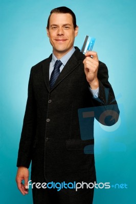 Male Executive Showing Credit Card Stock Photo