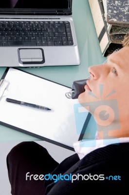 Male Executive Talking Over Phone Stock Photo