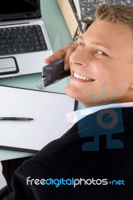 Male Executive Talking Over Phone Stock Photo