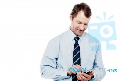 Male Executive Using Is Cell Phone Stock Photo