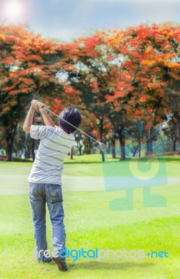 Male Golf Player Teeing Off Golf Ball Stock Photo