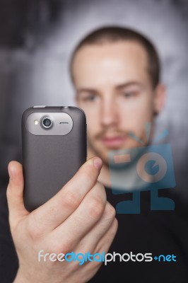 Male Holding Smartphone Stock Photo