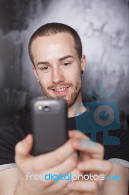 Male Holding Smartphone Stock Photo