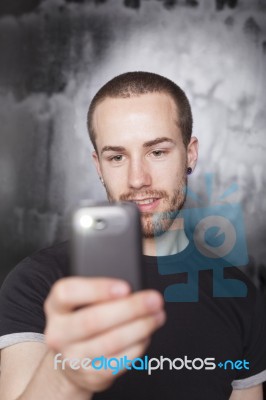 Male Holding Smartphone Stock Photo
