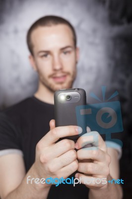 Male Holding Smartphone Stock Photo