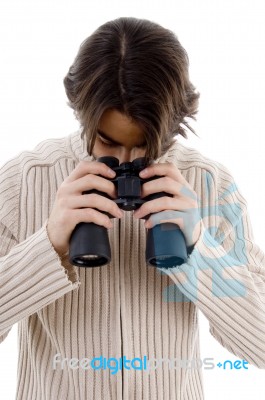 Male Looking Downward Through Binocular Stock Photo