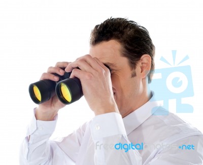 Male Looking Through Binocular Stock Photo