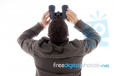 Male Looking Through Binoculars Stock Photo