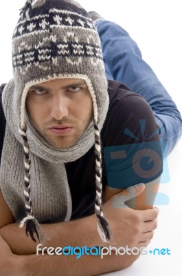 Male Lying And Wearing Woolen Cap Stock Photo